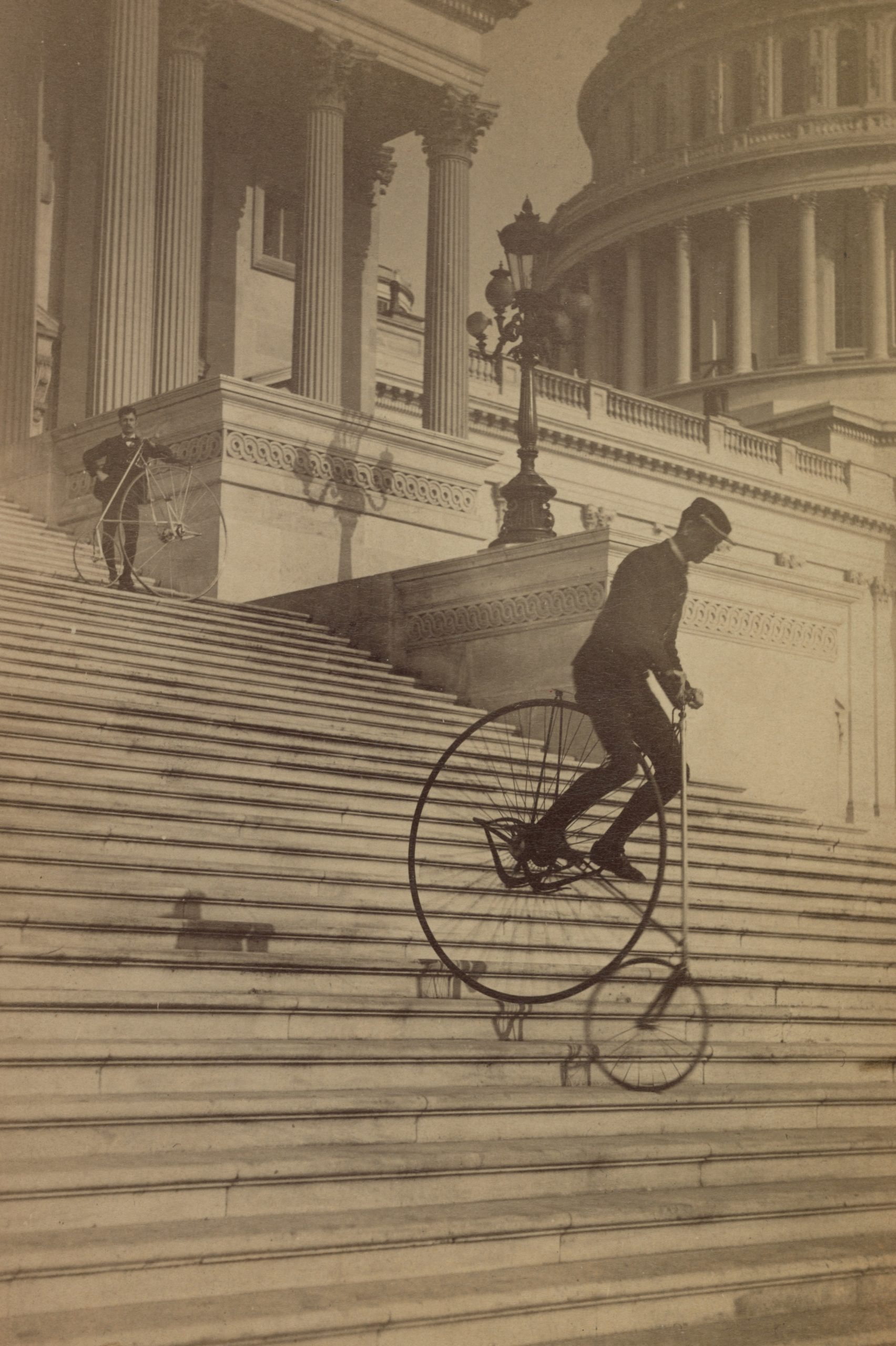 Man-riding-down-congress-stairs